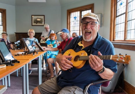 The Saltburn ukulele club play their instruments