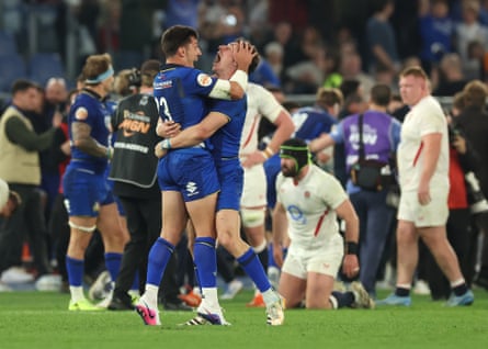 Italy’s Tommaso Allan and Paolo Garbisi celebrate victory against England in Rome.