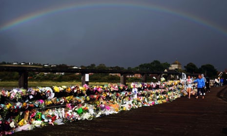 A rainbow over floral tributes at the Old Tollbridge near the A27 at Shoreham, after the Shoreham airshow crash.