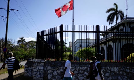 People pass by the Canadian embassy in Havana, Cuba, 16 April 2018. 
