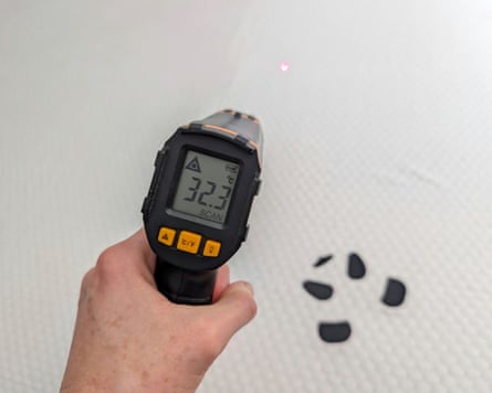 Infrared thermometer being pointed at the Panda bamboo mattress topper.