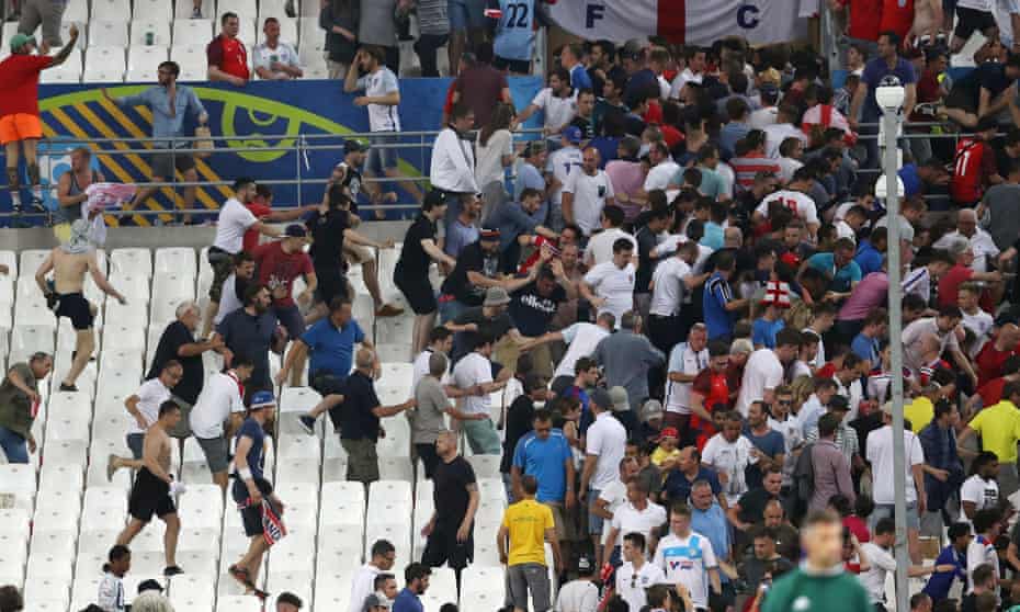 Fans clash in the stadium after the game between England and Russia in Marseille last summer.