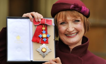 Tessa Jowell holds her Dame Commander insignia after it was presented to her by the Prince of Wales at Buckingham Palace in 2013
