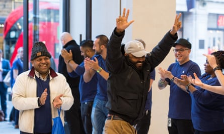 Two customers are clapped in to Apple’s London flagship shop on the day the iPhone 8 is launched.