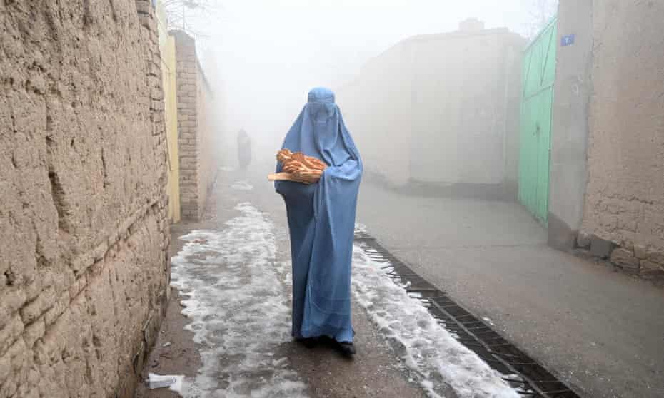 A woman walking in Kabul in January.