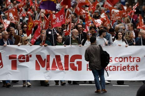 People take part in the Labor Day demonstration held in Valencia, Spain.