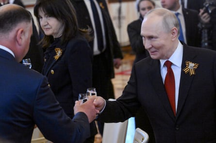 Vladimir Putinand the South Ossetian president, Alan Gagloev, toast one another during a reception held on Victory Day at the Kremlin in Moscow.