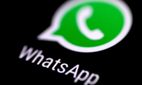 WhatsApp messaging application is seen on a phone screen