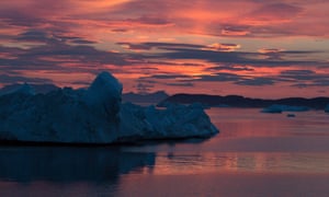 Sun sets over the glacier Zachariae Isstrom
