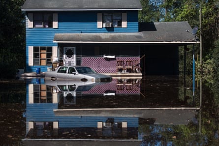 A residence is inundated with floodwaters from the Lumber River i 2016 in Fair Bluff, North Carolina.
