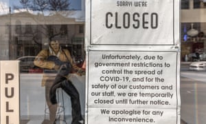 A closed due to Covid-19 restrictions sign is seen at the front of a restaurant on Chapel Street in Melbourne.