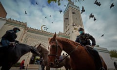 Mounted police patrol guard the Grand Mosque in Paris during prayers last Friday.