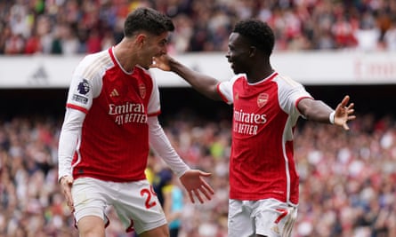 Bukayo Saka (right) celebrates with Kai Havertz after converting Arsenal’s first-half penalty.