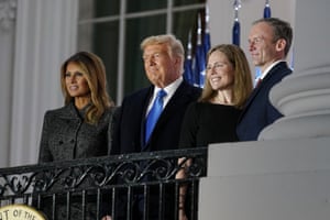 Melania Trump, Donald Trump, Amy Coney Barrett and Jesse Barrett stand on the balcony following the swearing-in ceremony.