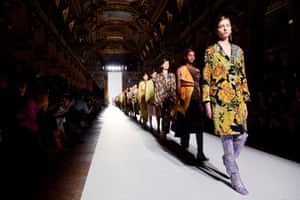 Models in serious boots and cheerful dresses at Dries Van Noten.