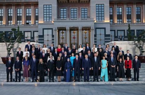 Turkish president Recep Tayyip Erdoğan and his wife, Emine Erdogan, pose for a family photo with participants during a reception hosted at the Presidential Complex in honor of heads of state and government and their spouses attending the 36th NATO Heads of State and Government Summit in Ankara, Turkey.
