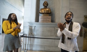 State Representative London Lamar, left, sings with activist Justin Jones in front of the Nathan Bedford Forrest bust in the Tennessee State Capitol yesterday. Jones led protests over the summer of 2020 to have the bust removed and this followed decades-long efforts to remove the bust of the Confederate general and early Ku Klux Klan leader.