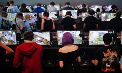 Gamers play video games during the opening Gamescom in Cologne, Germany, August 22, 2017.