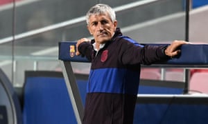 A disconsolate Quique Setién watches his Barcelona side succumb to Bayern Munich