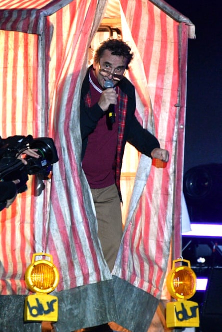 Phil Daniels comes out of a stripey road-workers’ tent at Wembley.
