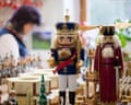 Two large wooden nutcracker characters stand among other smaller woodwork and figurines