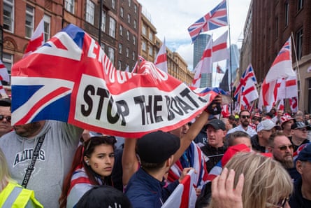 Protesters hold a ‘stop the boats’ banner at the ‘unite the kingdom’ rally in London on 13 September.