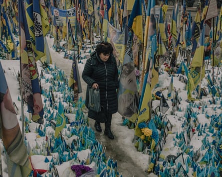 A woman at Maidan Square paying tribute to those who have died during the war