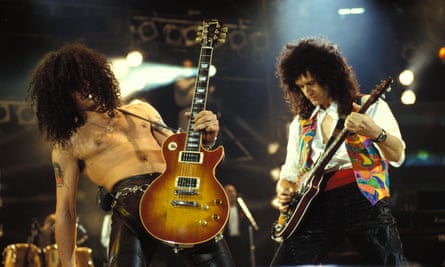 Slash from Guns N’ Roses on stage with Brian May. 