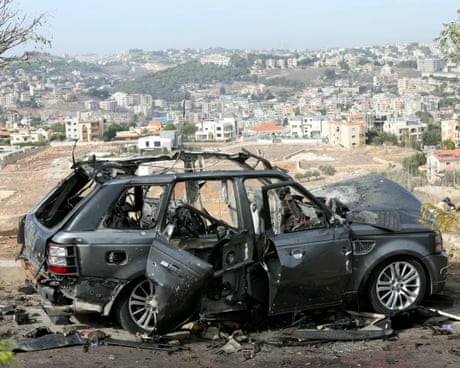 The wreckage of a vehicle after an Israeli airstrike in Kfar Reman