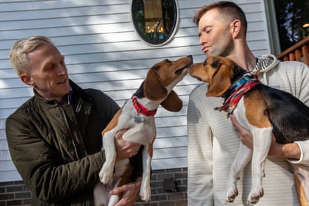 Friends Nick Wolters and Michael Woldarski hold pups Leo and Loki at Woldarski’s home in Winston-Salem, North Carolina. The friends adopted Envigo beagles Leo and Loki this past September.