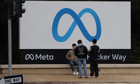 Visitors take photos outside Meta’s headquarters in Menlo Park, California