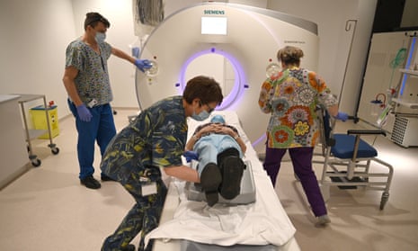 Clinical staff care for a patient as she has a CT (computed tomography) scan at Royal Papworth Hospital in Cambridge.
