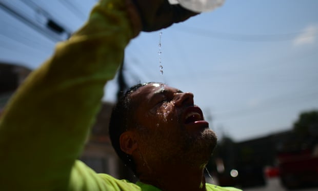 A construction worker attempts to cool off during a heatwave on 4 August 2022 in Philadelphia, Pennsylvania.