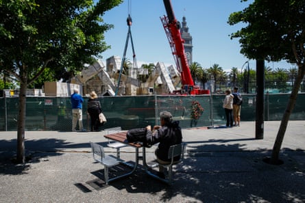 people looking at a destruction of the fountain