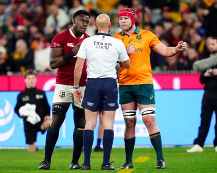 Lions captain Maro Itoje (left) and Australia captain Harry Wilson (right) discuss the call of referee Andrea Piardi