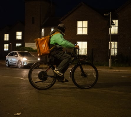 A Just Eat rider at night