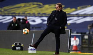 Hearts manager Robbie Neilson kicks the ball on the touchline.