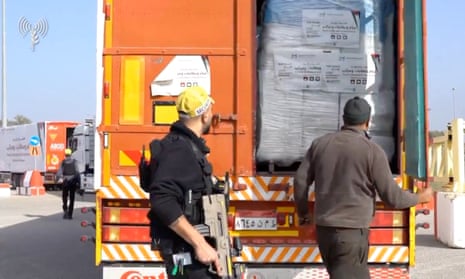 A humanitarian aid truck is inspected at the Kerem Shalom crossing in footage released on Tuesday