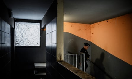A policeman inside a block of flats.