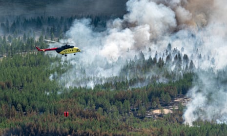 A helicopter battles a wildfire in Khanty-Mansi, Siberia, July 2020.
