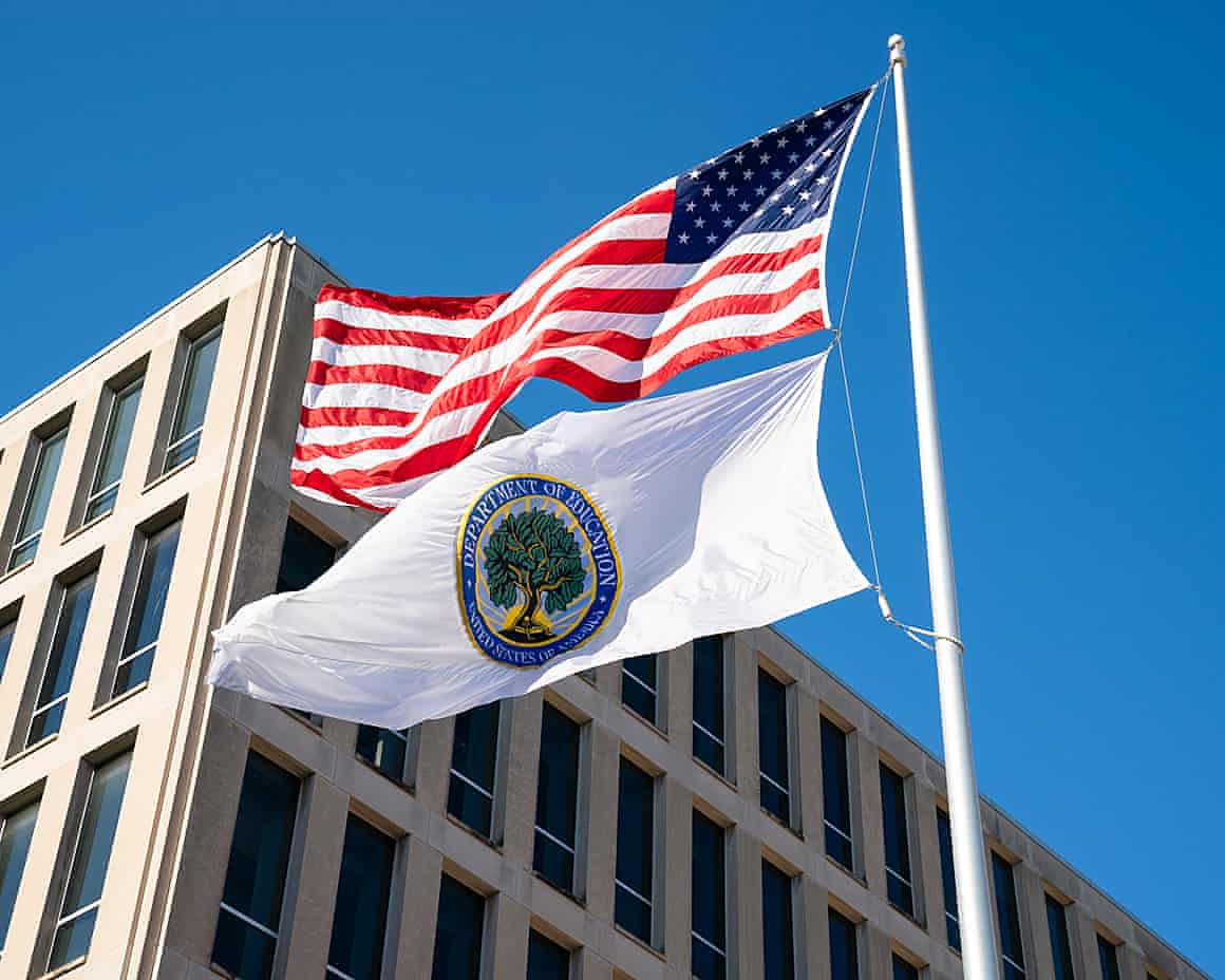 Flags for the US and the Department of Education fly outside the education department building in Washington