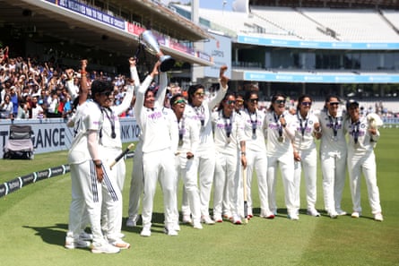 India's Harmanpreet Kaur (third left) lifts the trophy with teammates after victory in the Lord’s Test.