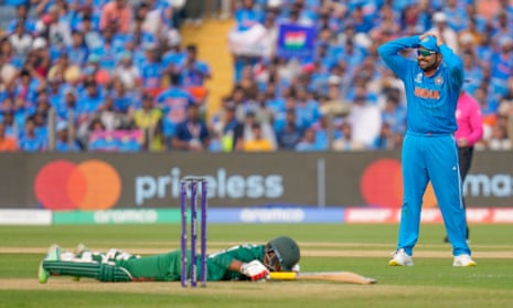 India's captain Rohit Sharma reacts to a close chance to run out Bangladesh's Towhid Hridoy.