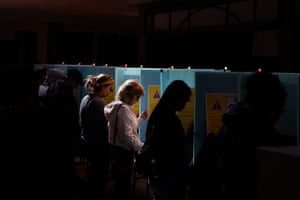 People cast their ballots at voting booths