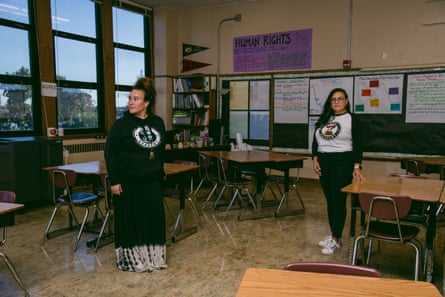 Two women posing in a classroom for a picture