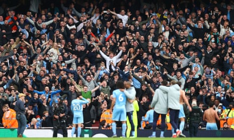Manchester City fans celebrate following the match.