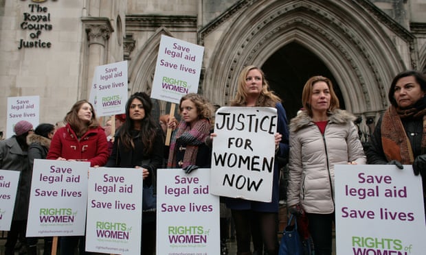 A demonstration outside the Royal Courts of Justice, central London, over government changes to legal aid for victims of domestic violence.