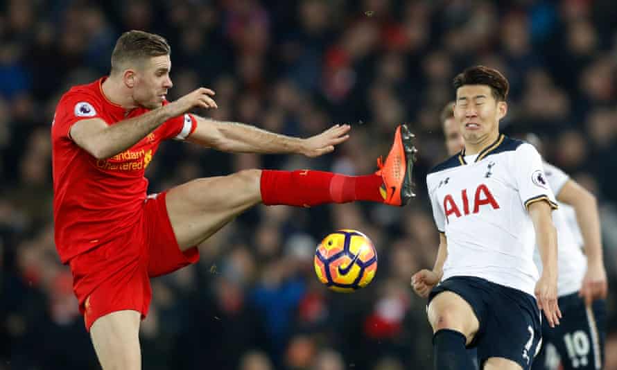 Liverpool’s Jordan Henderson in action with Tottenham’s Son Heung-min.