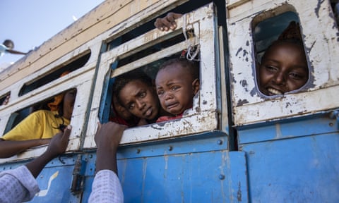 Refugees who fled the conflict in Tigray on a bus heading towards a temporary camp in Hamdayet in Sudan.