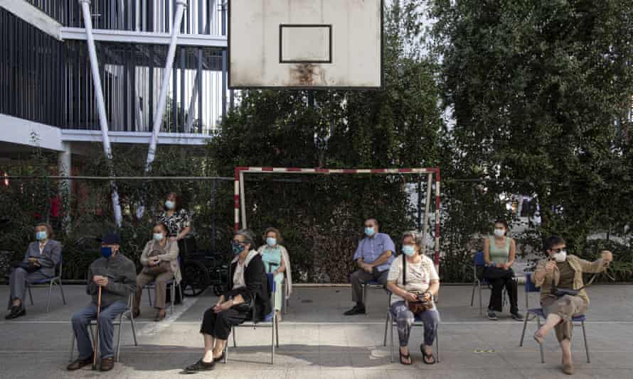 People wait to receive their second dose of the Covid-19 vaccine in Santiago, Chile